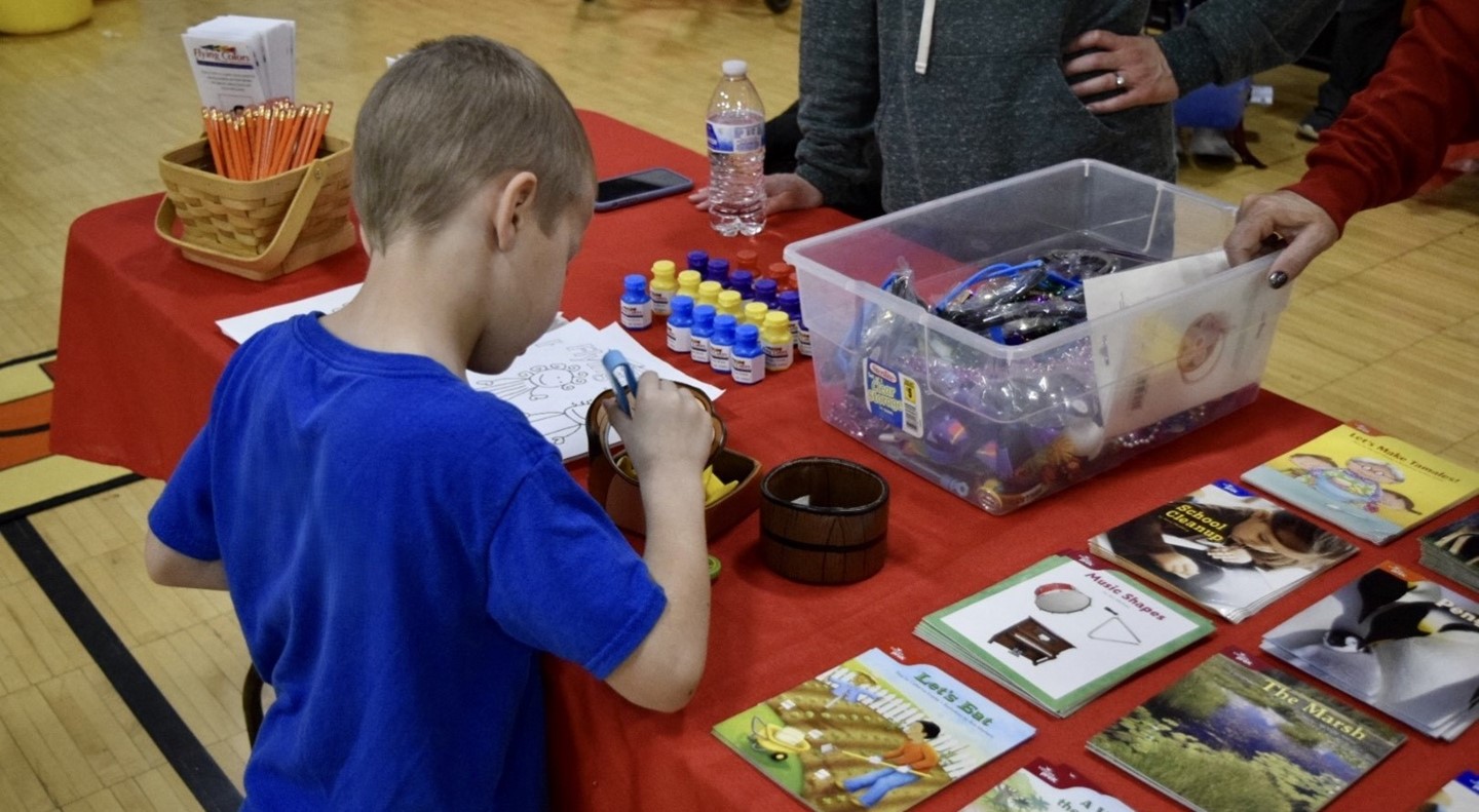 Child at Preschool Enrollment Table